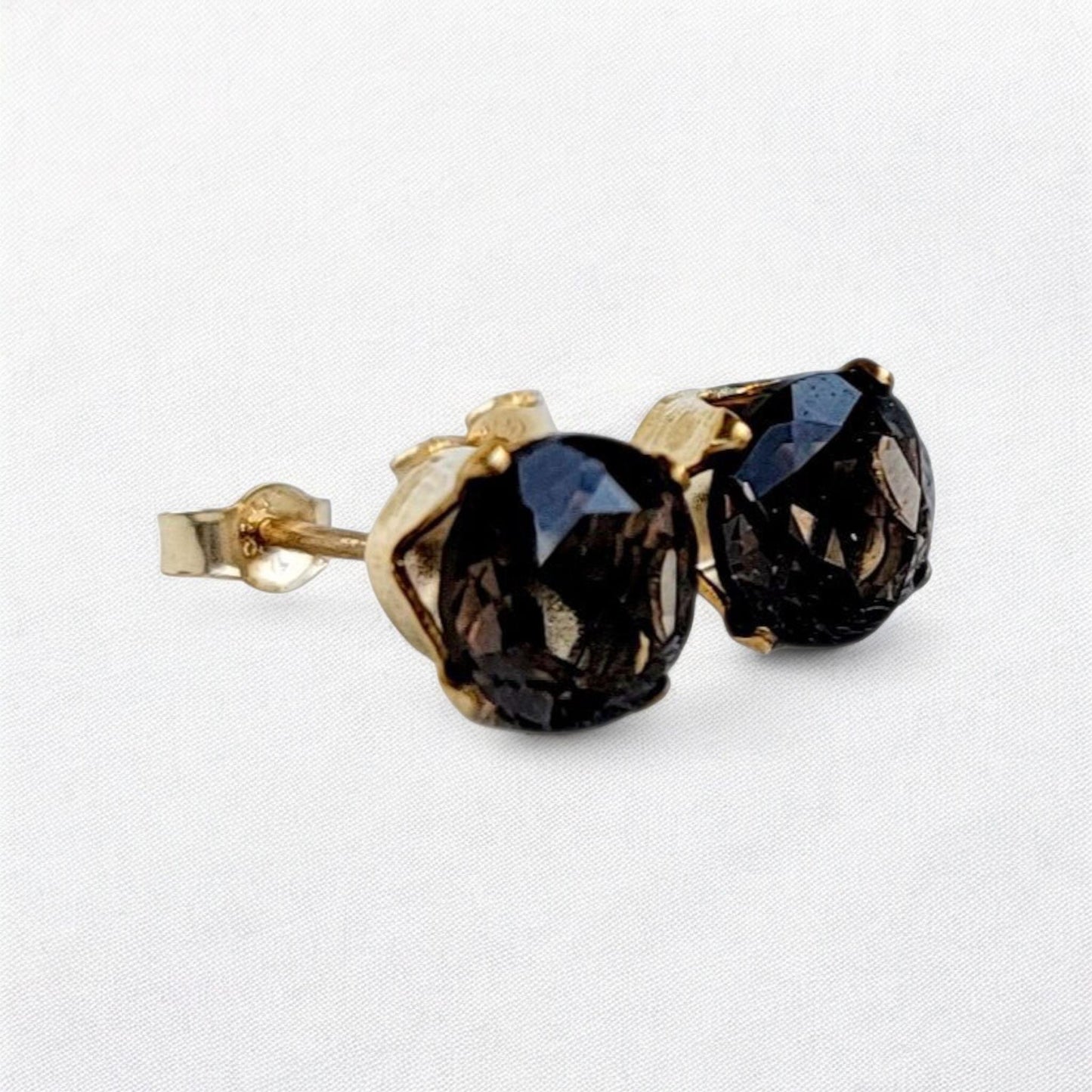 Smoky quartz stud earrings in 14k gold, gold filled, or sterling silver — available in 3mm, 4mm, 5mm, and 6mm sizes.