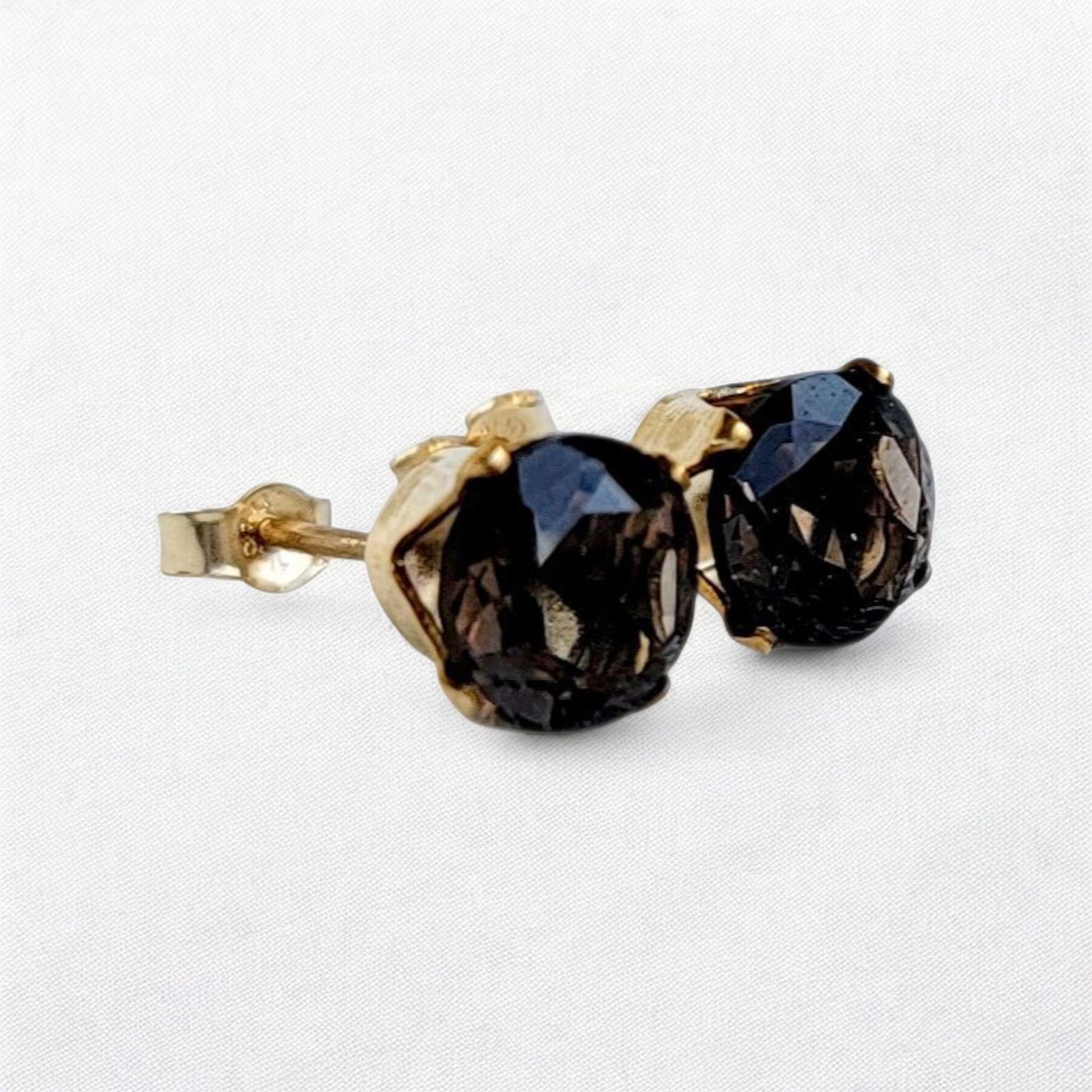Smoky quartz stud earrings in 14k gold, gold filled, or sterling silver — available in 3mm, 4mm, 5mm, and 6mm sizes.