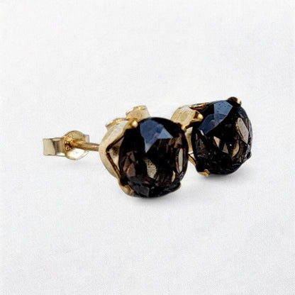 Smoky quartz stud earrings in 14k gold, gold filled, or sterling silver — available in 3mm, 4mm, 5mm, and 6mm sizes.