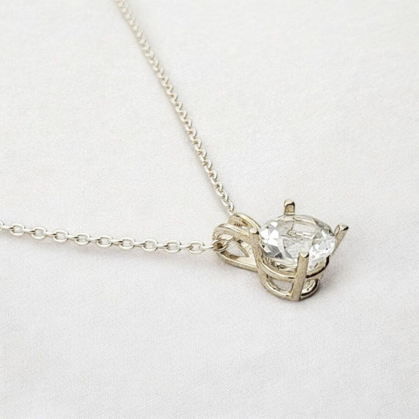 White topaz pendant necklace in 14k gold or sterling silver, available in 6mm–3mm with 16 or 18 inch chain.