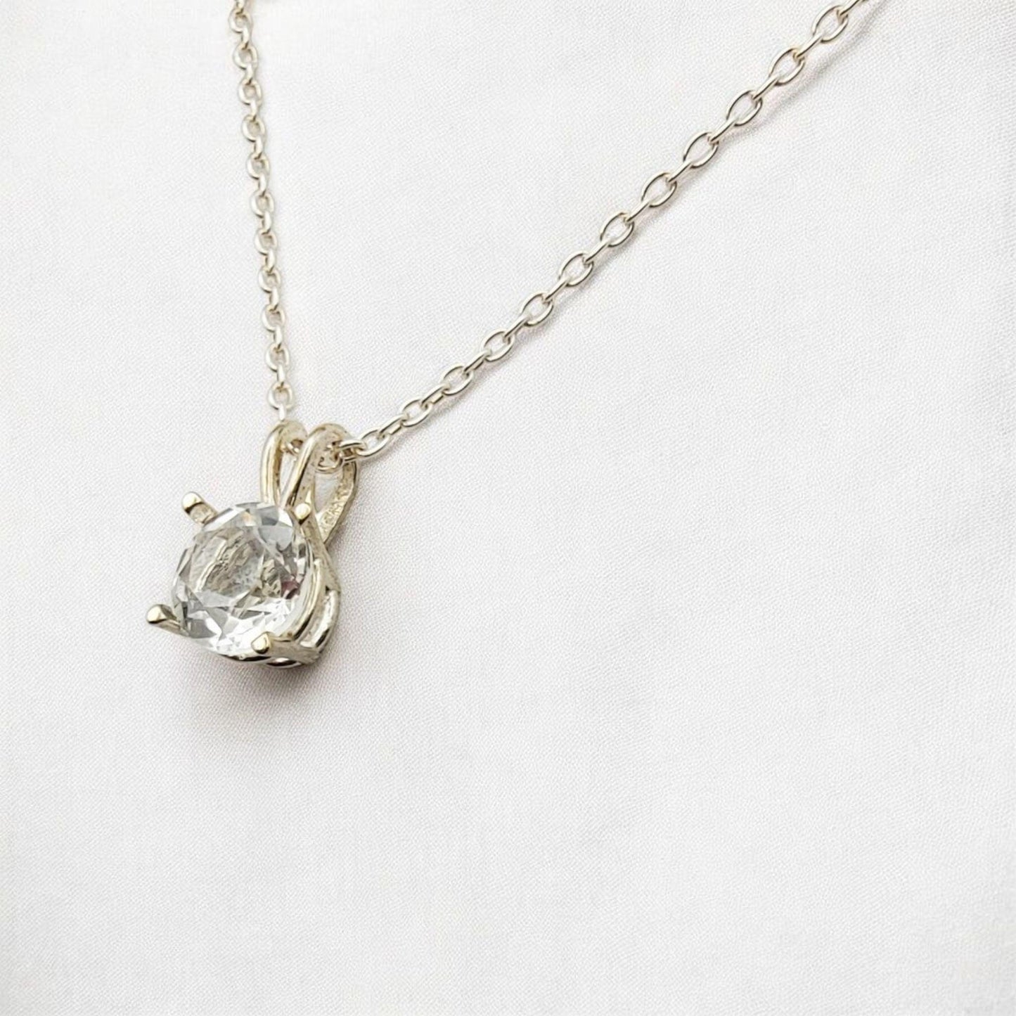 White topaz pendant necklace in 14k gold or sterling silver, available in 6mm–3mm with 16 or 18 inch chain.