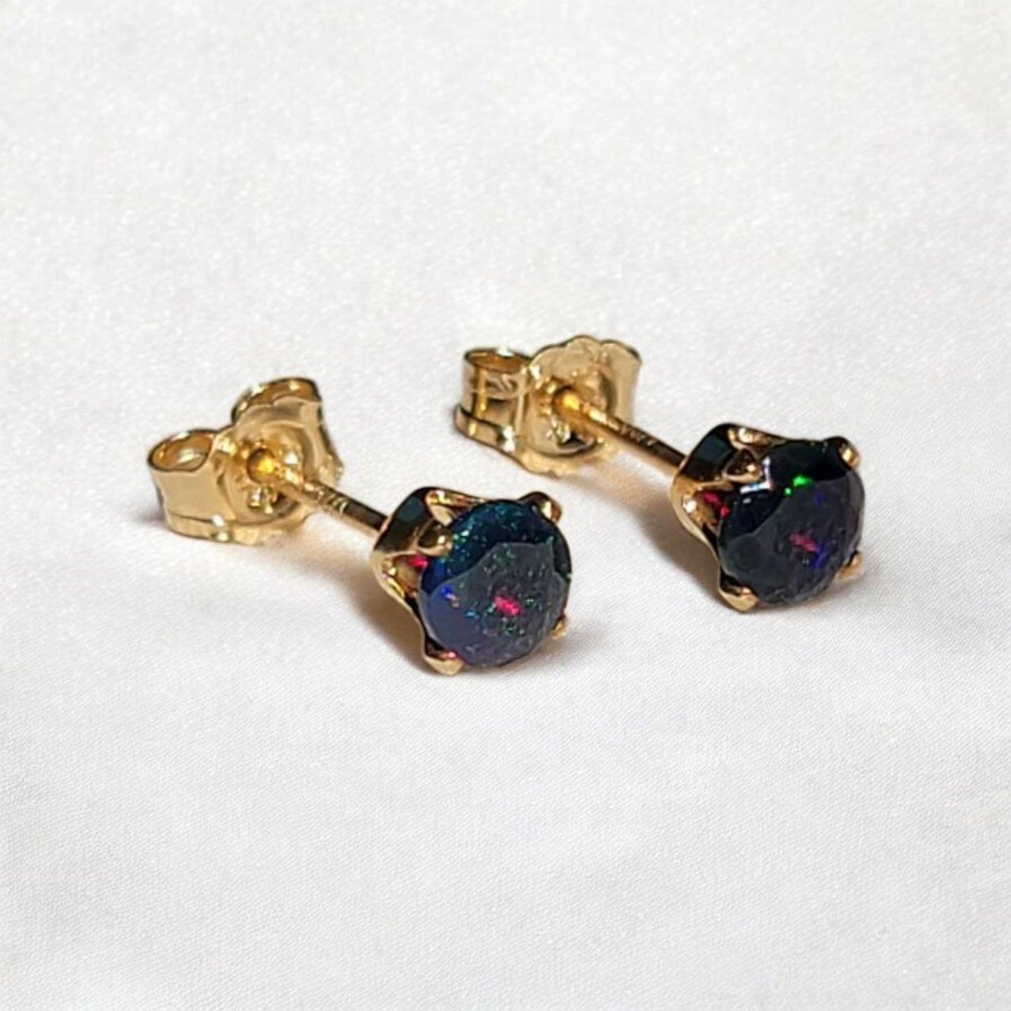 Black opal stud earrings in 14k solid gold, gold filled, or sterling silver — available in white, yellow, or rose gold and sizes 3mm, 4mm, 5mm, 6mm — natural black opal gemstone studs with colorful iridescence, October birthstone jewelry gift.