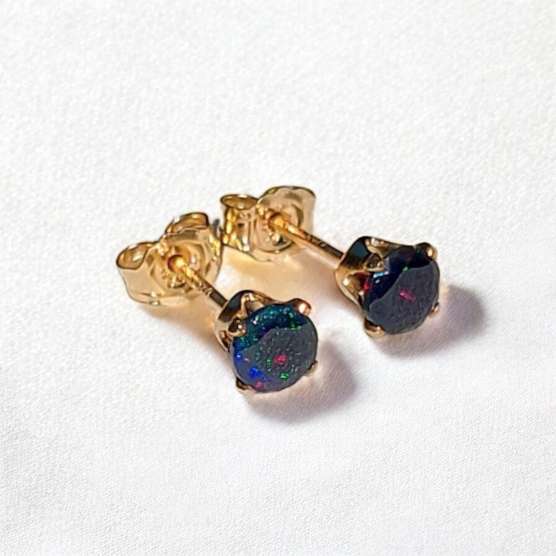 Black opal stud earrings in 14k solid gold, gold filled, or sterling silver — available in white, yellow, or rose gold and sizes 3mm, 4mm, 5mm, 6mm — natural black opal gemstone studs with colorful iridescence, October birthstone jewelry gift.