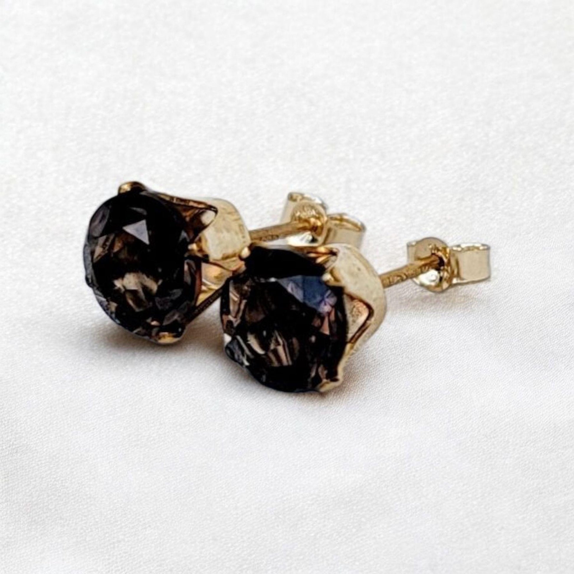Smoky quartz stud earrings in 14k gold, gold filled, or sterling silver — available in 3mm, 4mm, 5mm, and 6mm sizes.