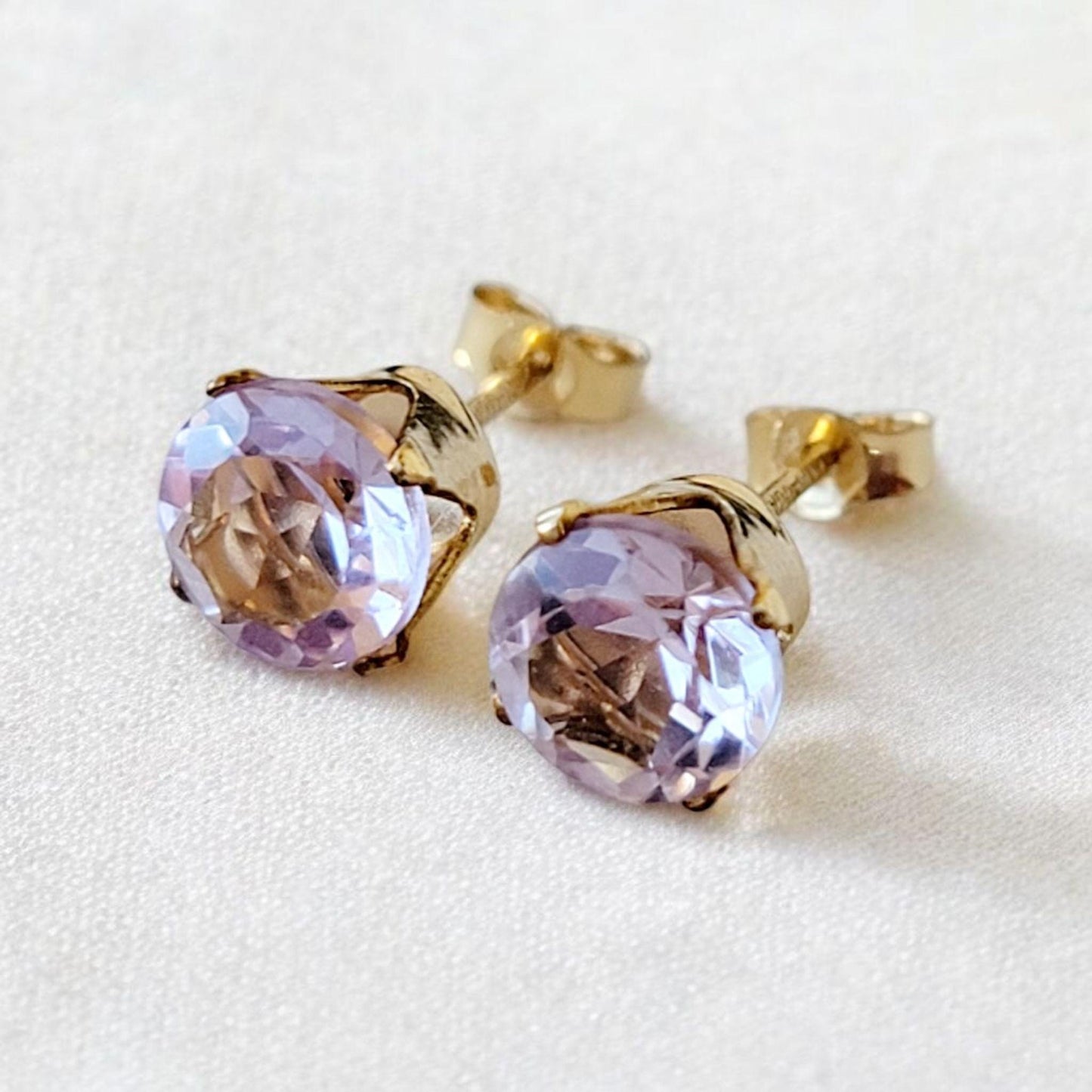 Pink amethyst stud earrings in 14k solid gold, gold filled, or sterling silver, available in 6mm, 5mm, 4mm, and 3mm sizes.