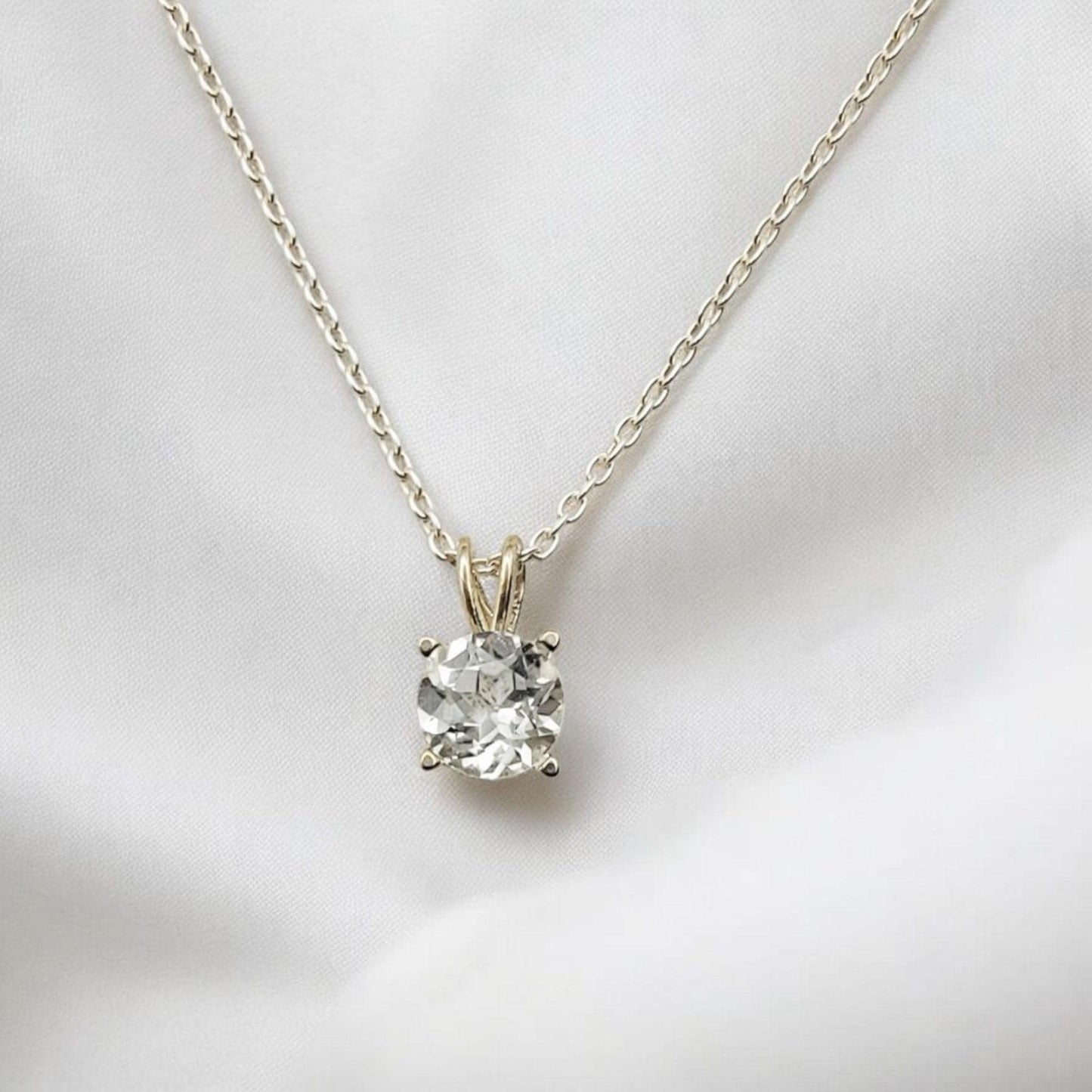 White topaz pendant necklace in 14k gold or sterling silver, available in 6mm–3mm with 16 or 18 inch chain.