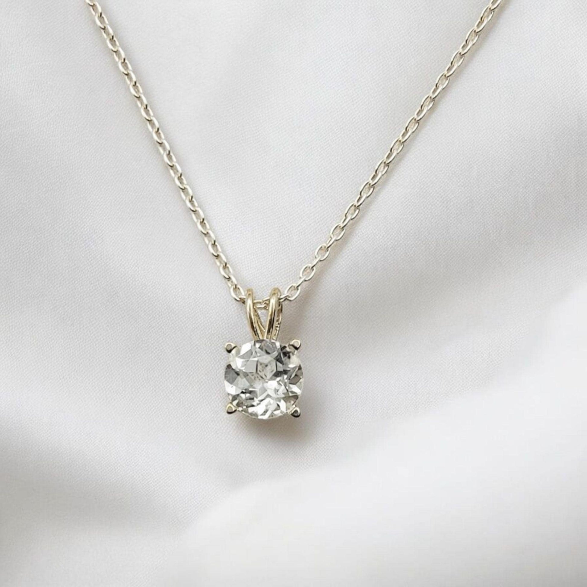 White topaz pendant necklace in 14k gold or sterling silver, available in 6mm–3mm with 16 or 18 inch chain.
