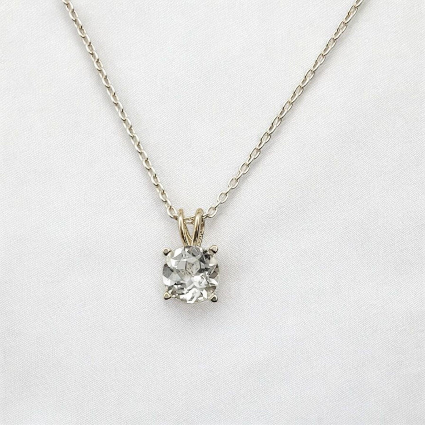 White topaz pendant necklace in 14k gold or sterling silver, available in 6mm–3mm with 16 or 18 inch chain.