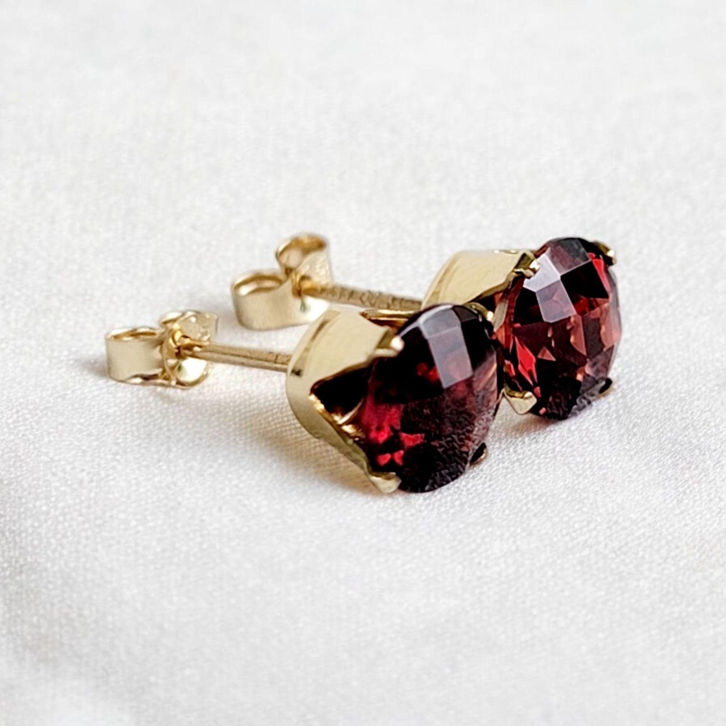 Checkered cut garnet stud earrings in 14k solid gold, gold filled, or sterling silver — available in white, yellow, or rose gold and sizes 3mm, 4mm, 5mm, 6mm — deep red garnet gemstone studs with faceted checkered cut, January birthstone jewelry gift.