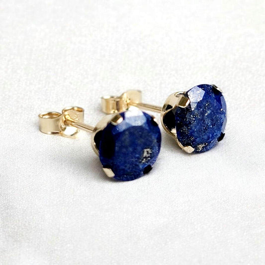 Close-up of round lapis lazuli gemstone stud earrings set in 14k solid gold or silver, small minimalist studs in 3mm, 4mm, 5mm, and 6mm.