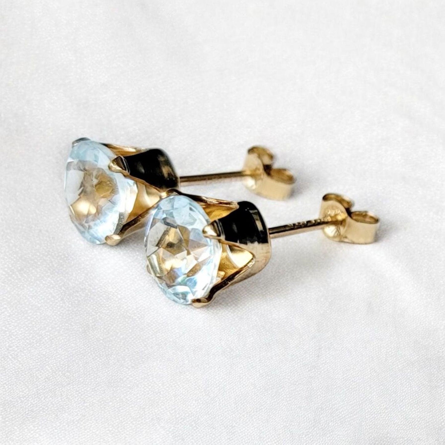 Sky blue topaz stud earrings available in 14k solid gold, gold filled, or sterling silver — choose rose, yellow, or white gold for a timeless natural gemstone style.