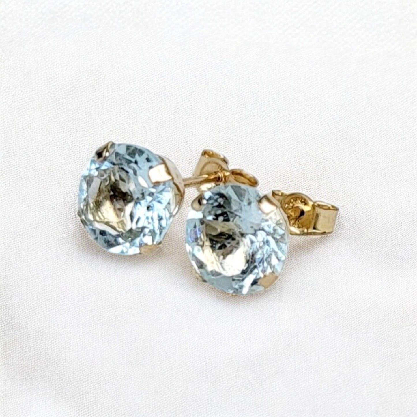 Sky blue topaz stud earrings available in 14k solid gold, gold filled, or sterling silver — choose rose, yellow, or white gold for a timeless natural gemstone style.